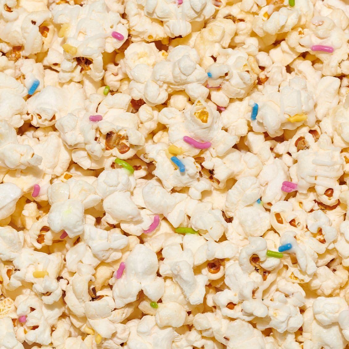 close up of birthday cake drizzled popcorn