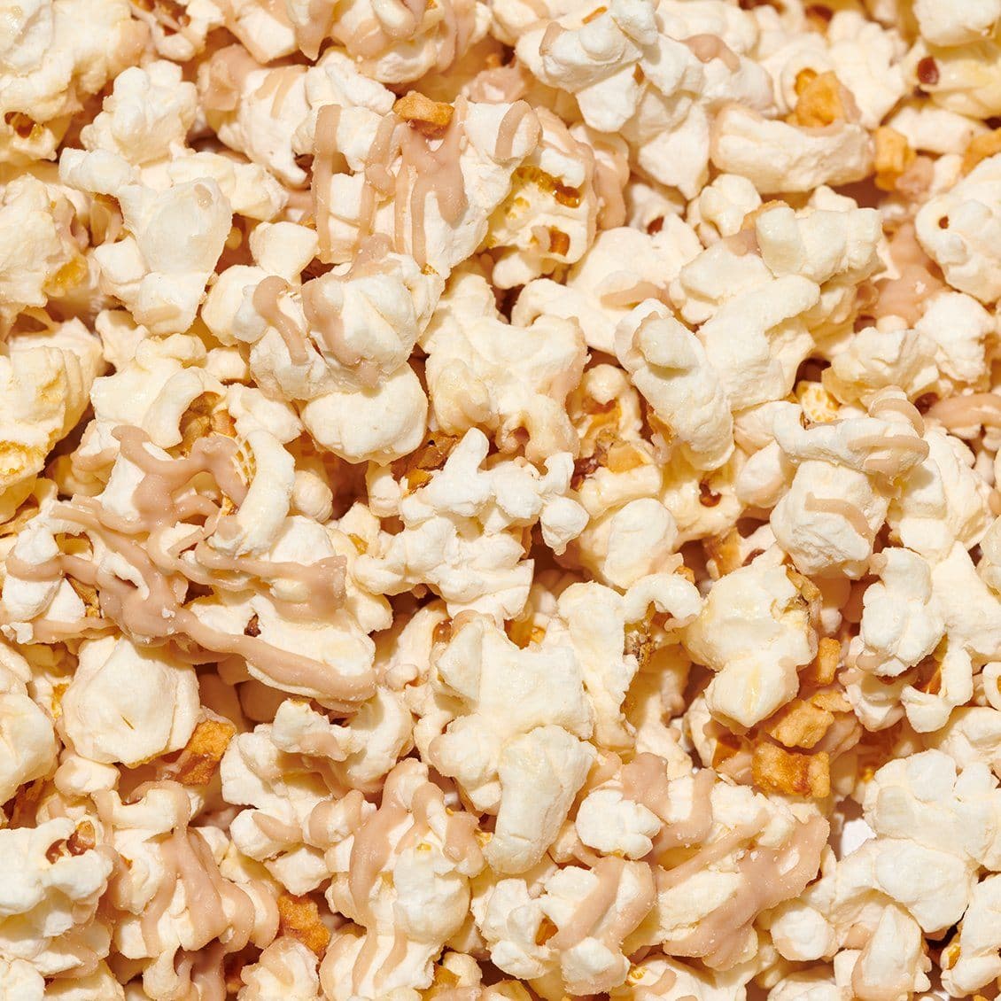 close up of honeycrisp apple pie drizzled popcorn